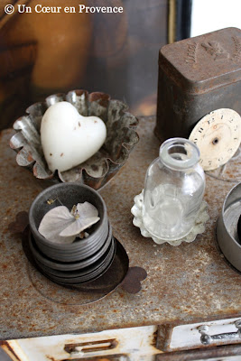 Mini molds, an old clock face and a small glass bottle
