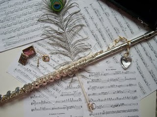 flute and peacock feathers