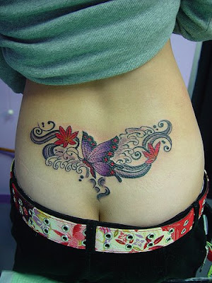 Back tattoo design of purple lotus flowers and butterfly tattoo.