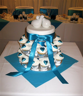 a top tier and cupcakes doth a wedding cake make