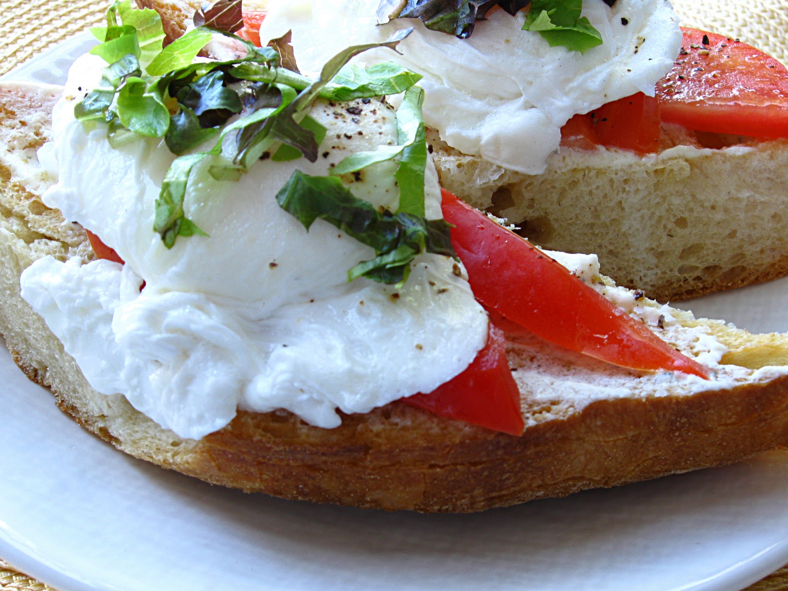 All That Splatters Poached Eggs on Toasted Baguette with Goat Cheese and BlackPepper Vinaigrette