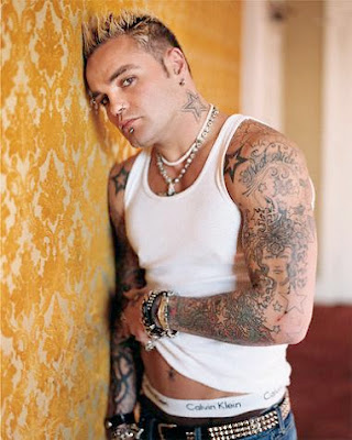 Black framed star tattoos on punk boy shoulders and neck.