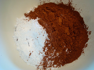 Chocolate chips, sugar and cocoa powder in bowl