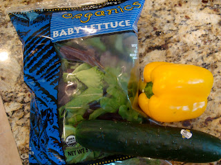 Baby Lettuce, Yellow Pepper and Cucumber on countertop