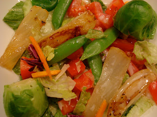 Fennel tossed with fresh vegetables and greens