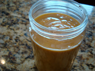 Side view of Homemade High Raw Vegan Peanut Sauce in glass jar