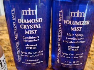 Two bottles of Conditioner Moisturizer and Hair Spray