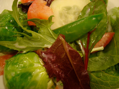 Close up of mixed salad dressed with Vegan Slaw Dressing