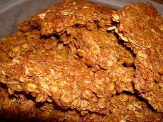 Chunks of Vegan Gluten & Soy-Free Homemade Granola stacked on top of one another