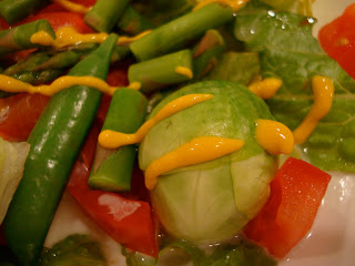 Close up of Salad with vegetables drizzled with mustard
