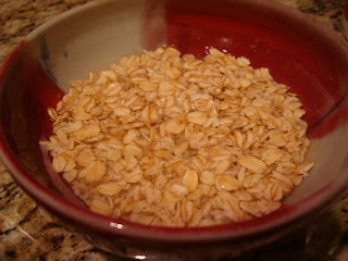 Rolled oats in bowl soaking in water