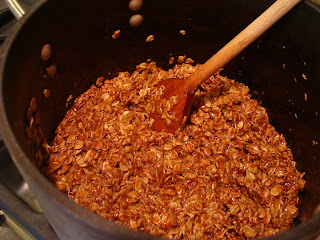 Granola mixture being stirred up in pot