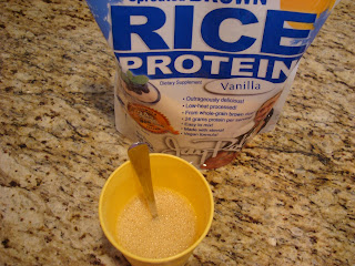 Bag of brown rice protein powder with cup with powder and water being mixed