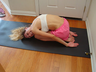 Woman doing Child's yoga pose