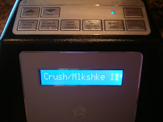 Digital display on blender showing buttons above