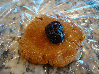 Close up of Donut holes topped with maple syrup and Raz-Cherry