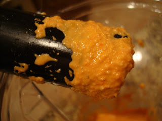 Tamper holding up some of the blended mixture