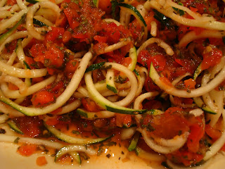 Close up of mixed up Raw Vegan Pasta Noodles & Raw Marinara