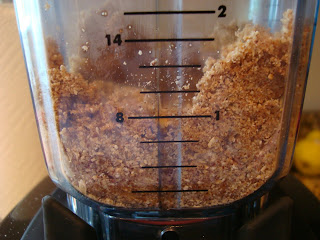 Side view of ingredients for crust for Raw Vegan Apple Crumble in blender