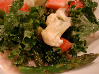 Up close of Kale salad on white plate