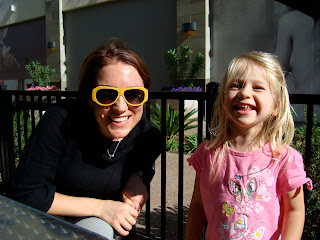 Woman and young girl sitting and smiling