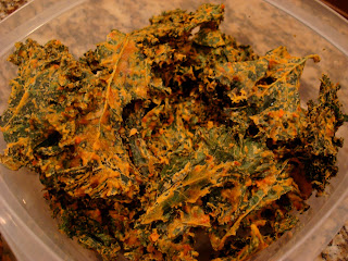 Kale chips stacked in clear container