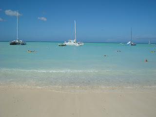 Boats out in water at beach