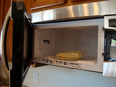 Wrapped corn in microwave