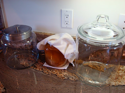 Canisters next to a batch of Kombucha
