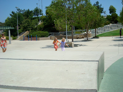 Two girls chasing each other