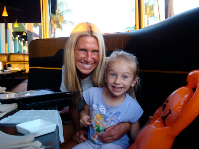 Woman and child in booth smiling