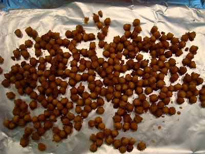 Coated chickpeas on foil lined baking pan