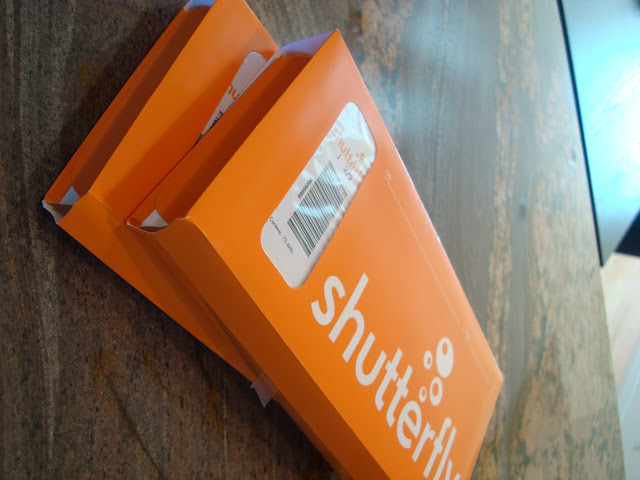 Two orange Shutterfly boxes