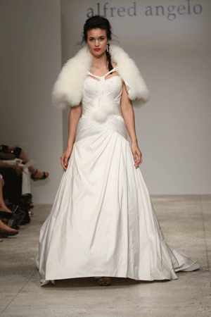 I love the feathers fur and fluff of a winter wedding dress