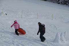 Rylee shows Grandpa how to tube.