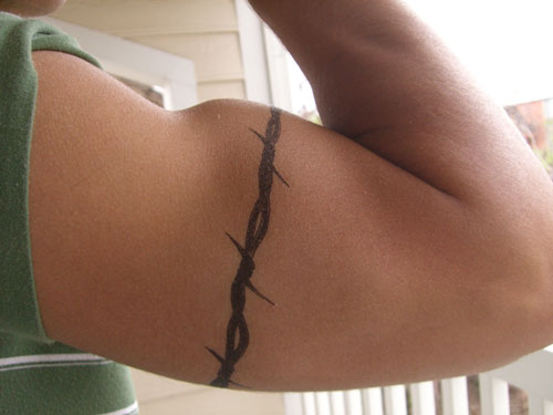 Tattoos men should never get like barbed wire around the arm 
