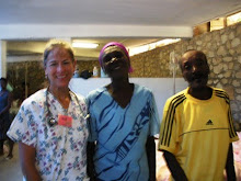 Gentleman in yellow shirt is a happy former cholera patient who is going home!