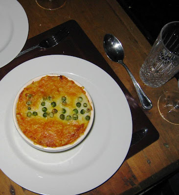 Top of a pie with 'Lola' spelled out in peas