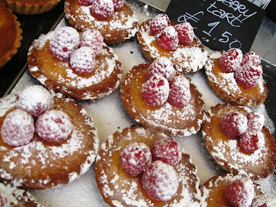 Raspberry tarts dusted with icing sugar