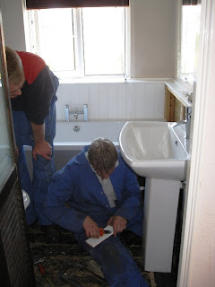 A and M working in the bathroom