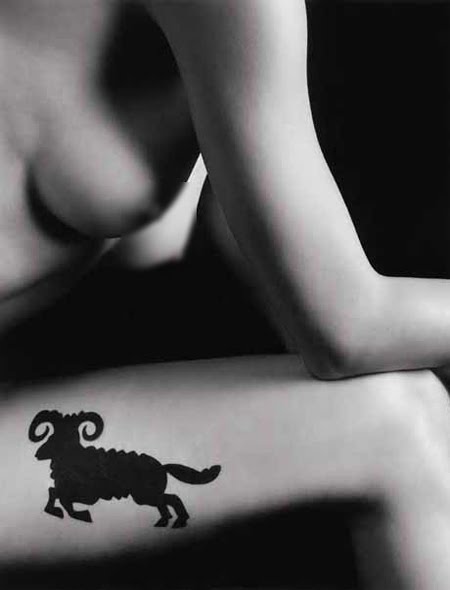 For more masculine Aries tattoos, the glyph can be used as the handles of a 