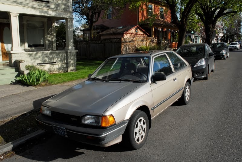 Old Parked Cars 1988 Mazda 323 Se