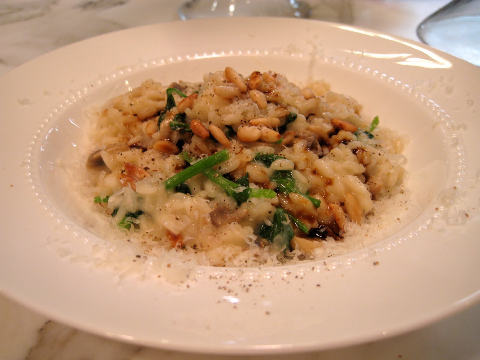 Mushroom and Pea Shoot Risotto with Roasted Pine Nuts and Brie