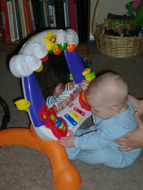 [Copy+of+Jamison+sitting+up+to+toy.JPG]