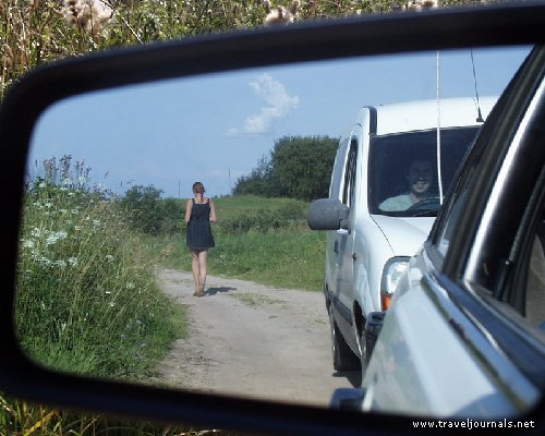 [53816-belarusian-country-girl-in-the-rear-view-mirror-braslav-lakes-belarus.jpg]