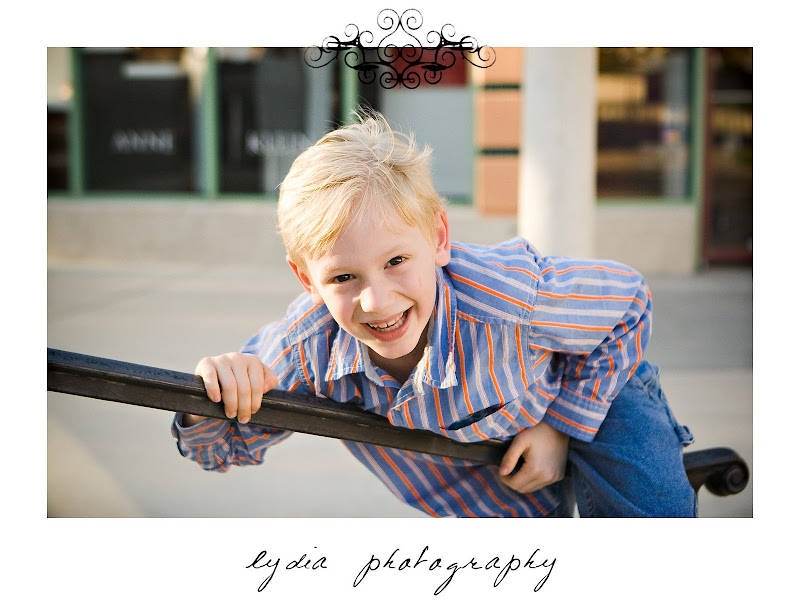 Little boy on the rail at lifestyle kids portraits in San Antonio, Texas