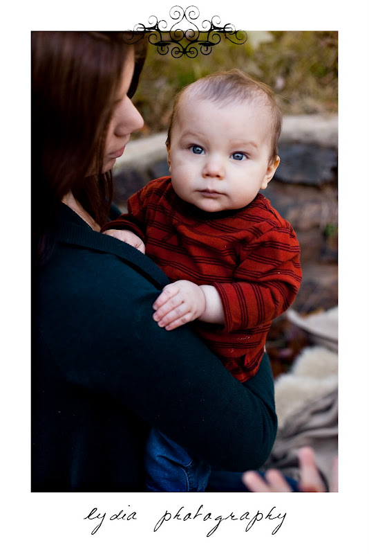 Baby in the arms of his mother at lifestyle kids portraits in Auburn, California