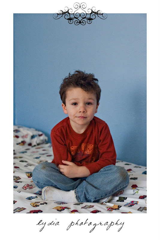 Little boy sitting on the bed at lifestyle kids portraits in Auburn, California
