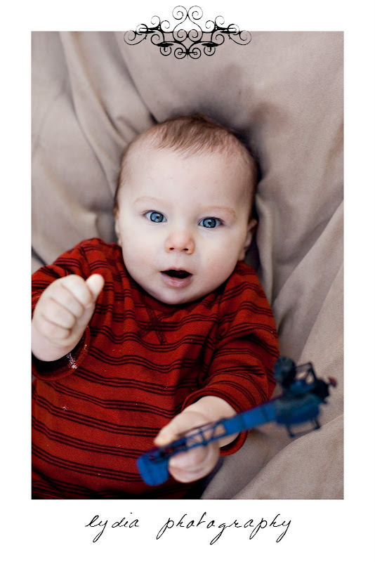 Baby with a helicopter in his hand at lifestyle kids portraits in Auburn, California