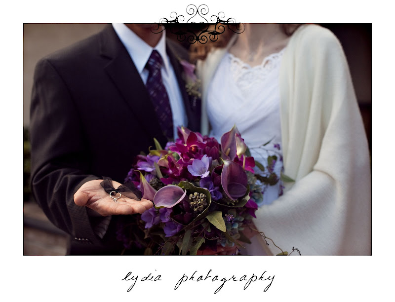 Bride and groom with bouquet at purple, winter wedding in Santa Rosa, California